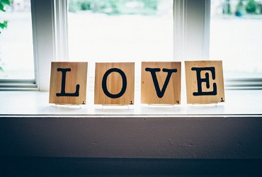 IWCE Giving Back - Love decor on the window -Photo by Andrew Seaman on Unsplash